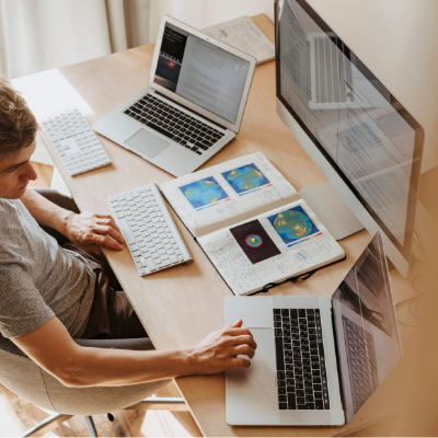 Person working on multiple screen